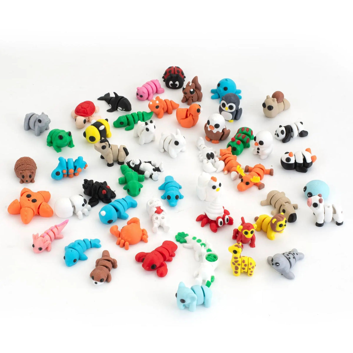 A collection of colorful articulated 3D animal figurines for desk decor, including various mammals and creatures.