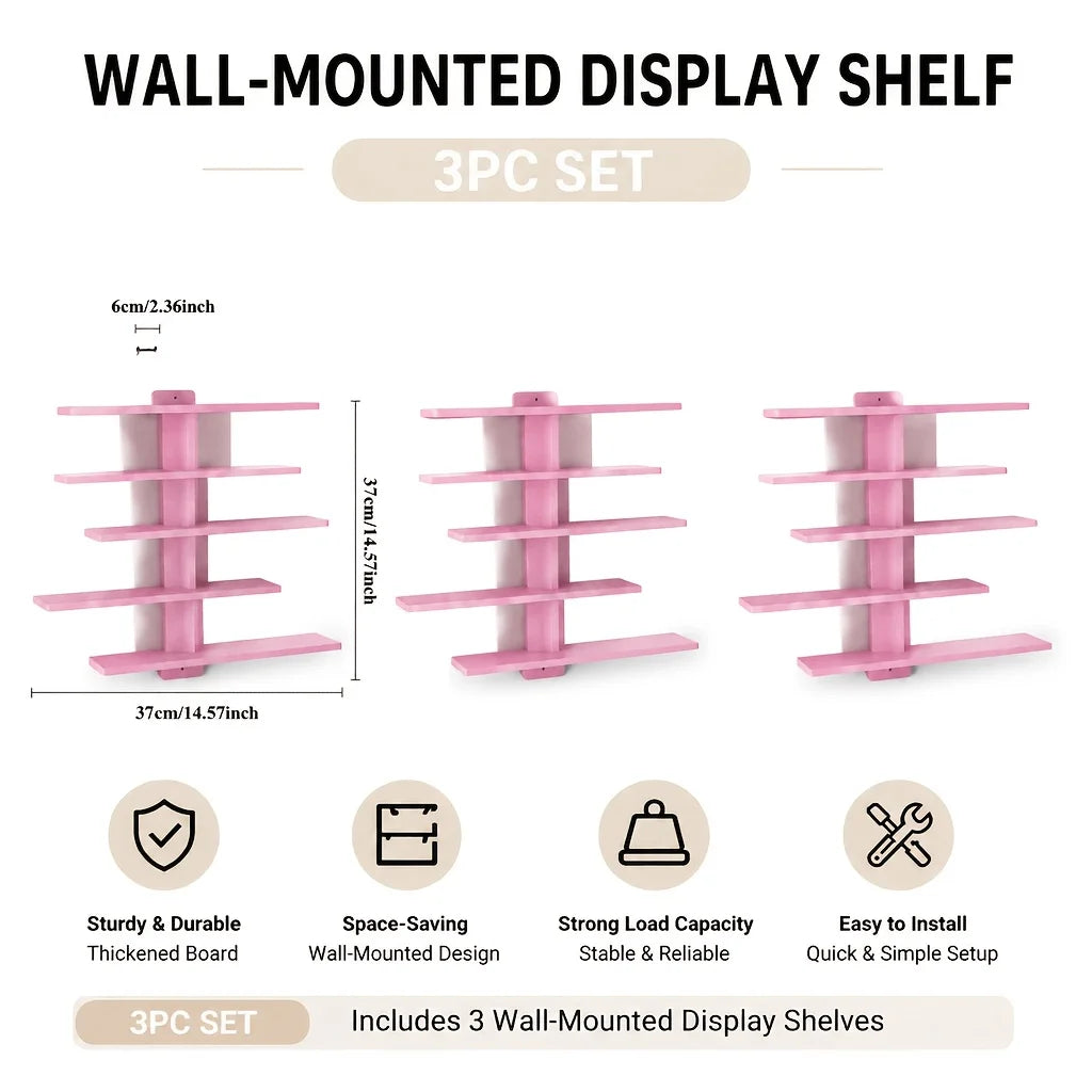 A set of three pink wall-mounted display shelves for home decor and storage.