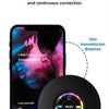 A black waterproof Bluetooth speaker is shown next to an iPhone displaying music.