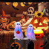 A set of lighted Halloween ghost decorations featuring glowing white ghosts and carved pumpkins in a spooky seasonal display.