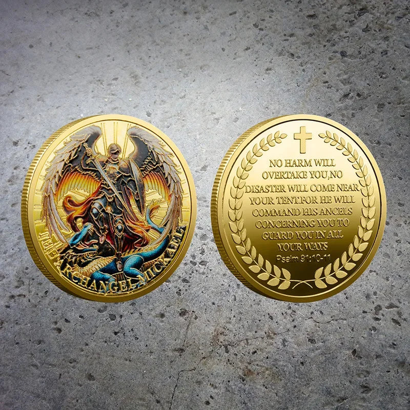 A gold-plated collectible coin featuring the Archangel Michael with wings and a cross design.