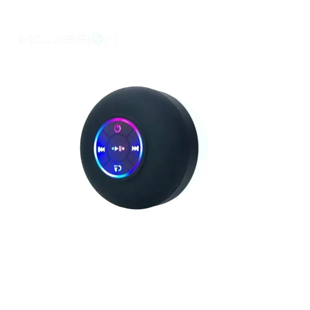 A black waterproof Bluetooth speaker with a suction cup feature, showing illuminated controls.