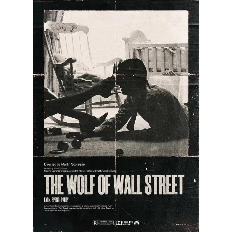 A black and white photo from The Wolf of Wall Street featuring a man in a suit looking down.
