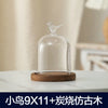 Glass aromatherapy candle holder with a clear dome and a wooden base