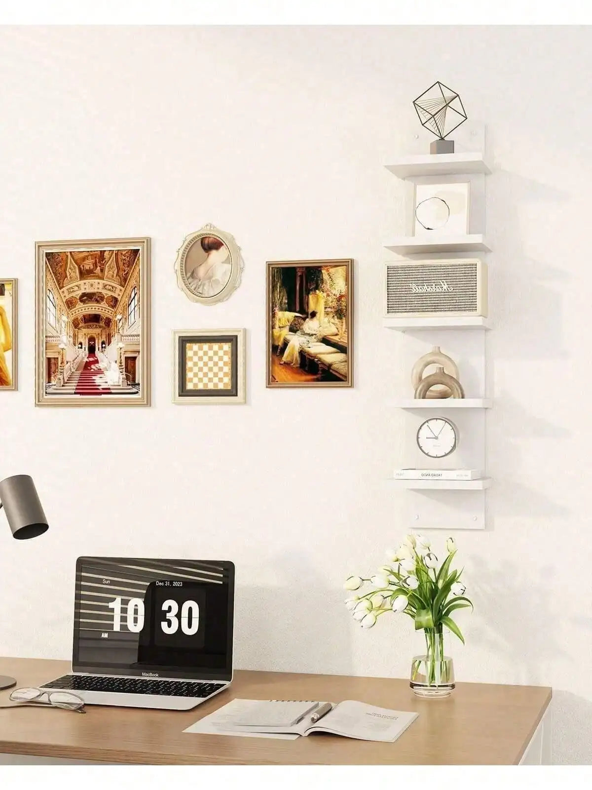 A modern white five-tier vertical wall shelf displaying framed art and decorative items.