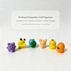 A set of six colorful kawaii figurines featuring fantasy creatures displayed on a white surface.