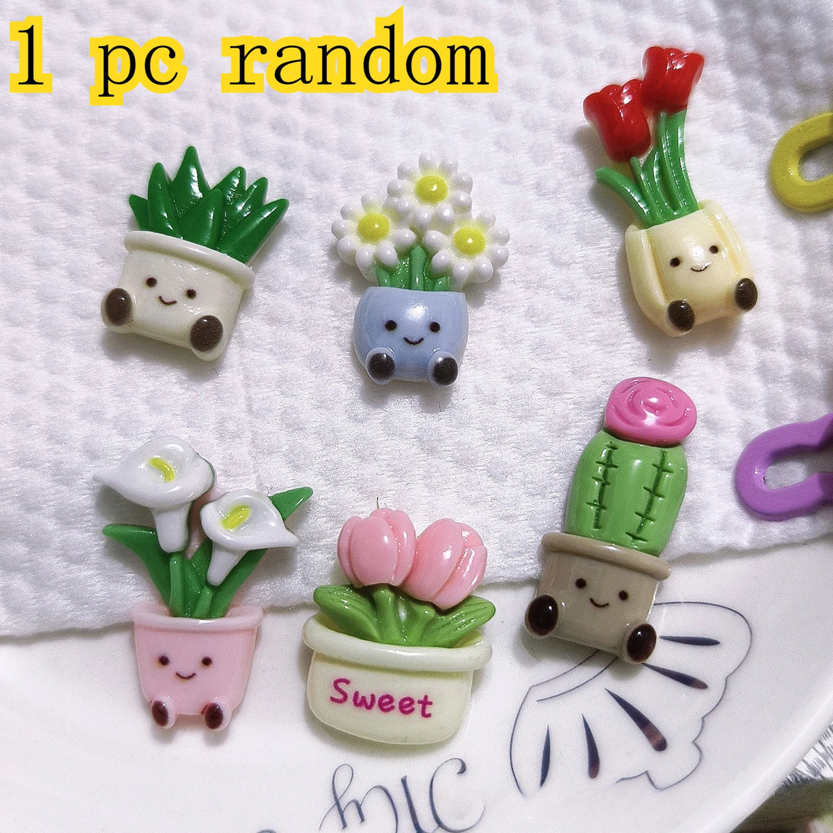A set of five kawaii potted plant fridge magnets featuring various flowers and succulents in pastel colors