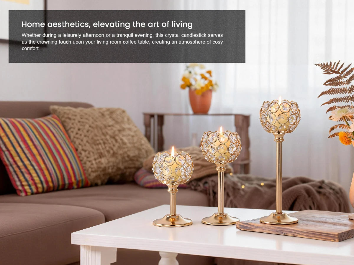 A set of elegant gold metal glass candle holders displayed on a white table next to a sofa.