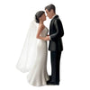 A bride and groom cake topper featuring a couple embracing in a white silhouette.