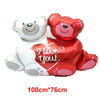 Red heart shaped foil balloons featuring a teddy bear design for a 'I Love You' message