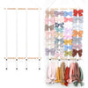 A display of colorful fabric headbands hanging on a wooden rack for girls