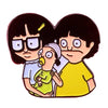 Enamel pin badge featuring a cartoon illustration of two characters.