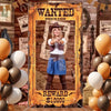 A woman dressed in a western outfit posing in a framed sign that reads WANTED and REWARD $10000