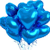 A bunch of shiny blue heart-shaped foil balloons tied together with strings.