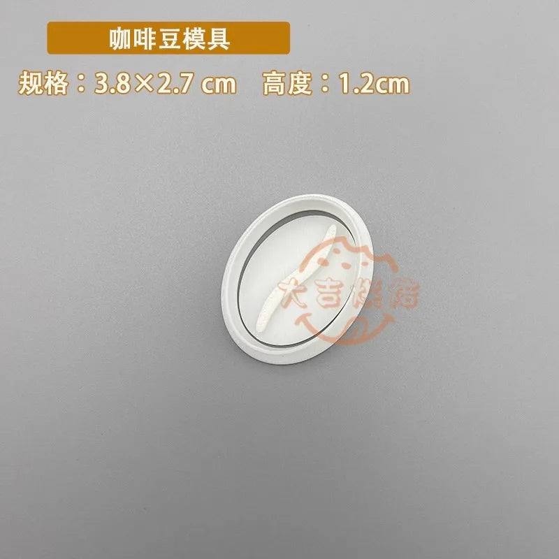 A white silicone stamp mold with a curved shape is shown on a gray background.