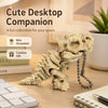 A light beige 3D printed T-Rex skeleton model with articulated joints sitting on a wooden desk.