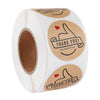 Roll of kraft paper thank you stickers with a thank you message on the label