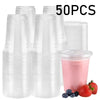 A stack of 50 clear plastic disposable cups with lids and a few fresh strawberries.