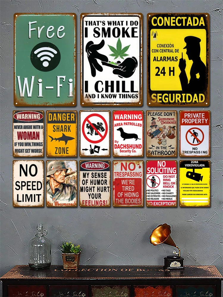 A collection of vintage metal signs featuring warnings and messages like Free Wi-Fi, I Smoke I Chill, and Connectada 24H Secu