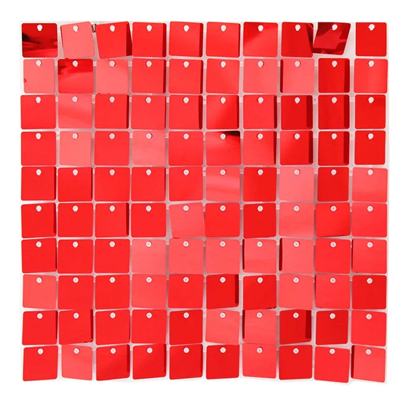 A grid of square, iridescent red sequins or panels used as a shimmering backdrop.