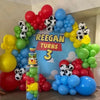 A colorful latex balloon garland featuring red, yellow, green, and blue balloons arranged in an arch shape.