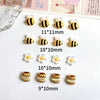 A collection of cute bee and daisy 3D resin nail art charms in various sizes and colors.