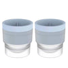 A pair of stackable spherical ice molds for whiskey and cocktails, shown in light gray.