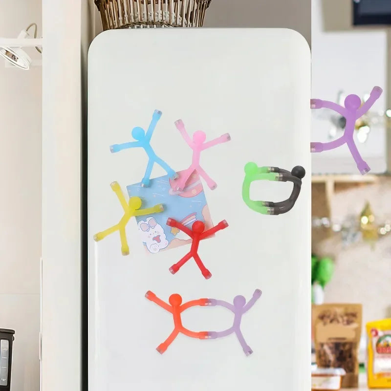 Colorful flexible mini figure refrigerator magnets featuring various colored figures on a white surface.