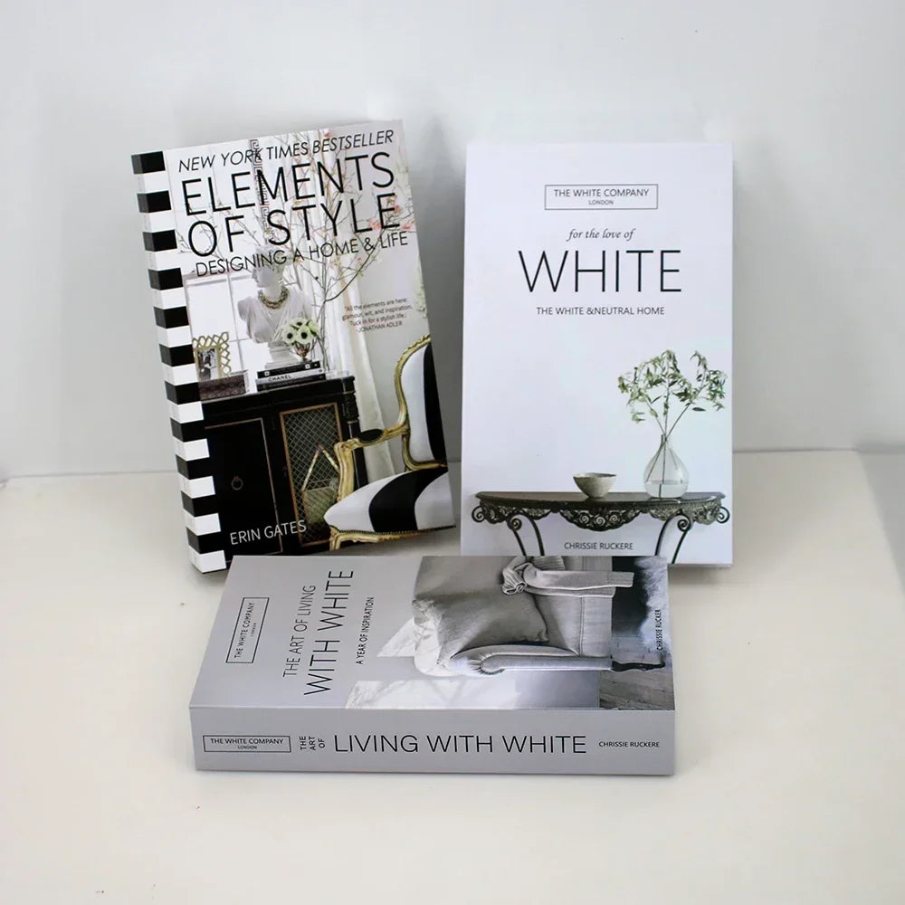 A set of three books titled Elements of Style, White, and Living with White by The White Company.