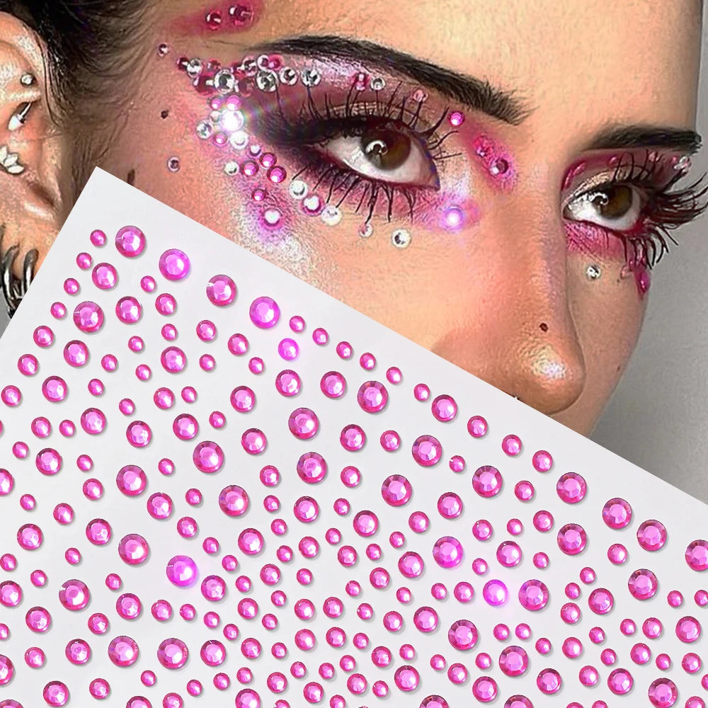 Close-up of a woman's face decorated with pink and clear glitter gems for facial tattoos