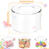 A clear acrylic cake stand with a lid and a base, shown next to various colorful desserts.