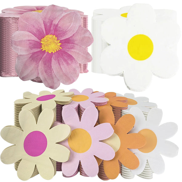 A collection of disposable pink daisy flower napkins in various shades including white, yellow, and orange.