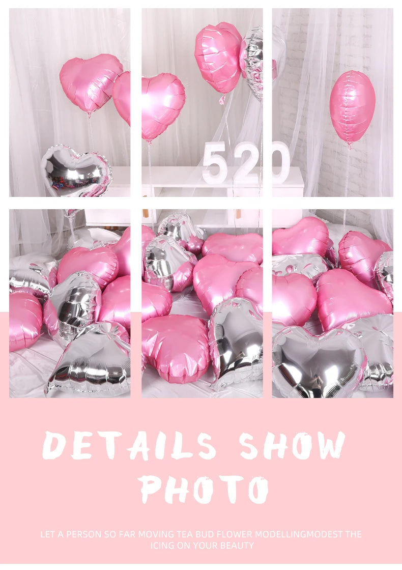 A collection of pink and silver heart-shaped foil balloons displayed on a white surface.