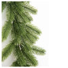 A close-up of a green artificial pine garland with long needles, suitable for holiday decorating.