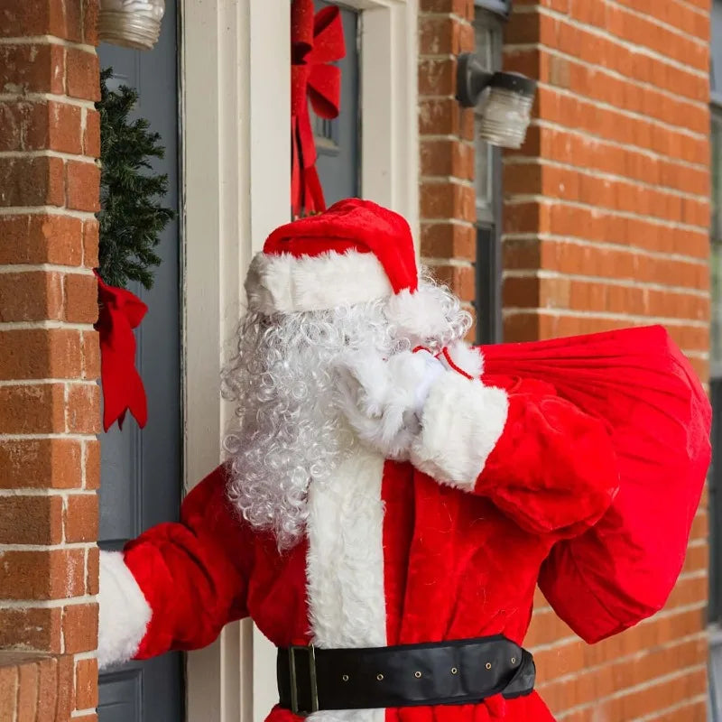 A person dressed as Santa Claus in a red suit and white beard is visible next to a door.