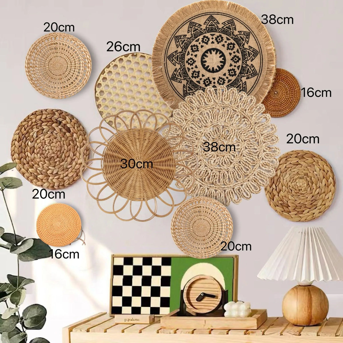 A collection of round boho straw wall hangings and woven tassels displayed on a wooden surface.