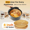 A black air fryer basket filled with fried food, surrounded by disposable round paper liners.