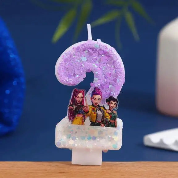 A purple glitter number 9 candle featuring characters from a cartoon set on a white base.