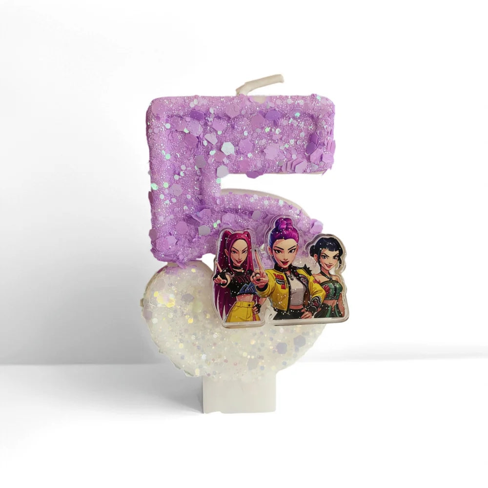 A purple glitter number five candle featuring illustrations of three female characters.