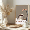 A framed canvas print featuring an abstract coffee theme with a cup and coffee beans.