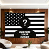 A large tapestry featuring the American flag design with a question mark overlay on a black background.