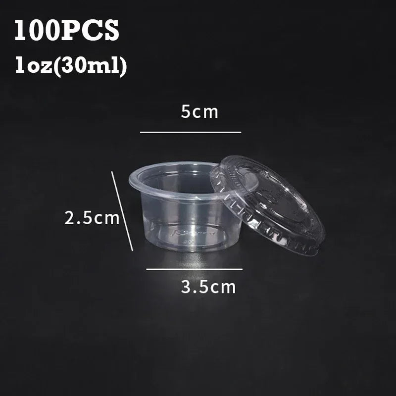A set of 100 disposable clear plastic sauce cups with lids shown against a dark background.