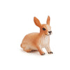 A realistic figurine of a light brown rabbit with detailed fur and features.