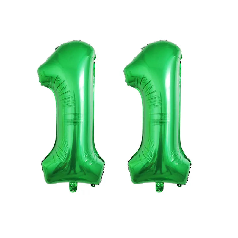 Two shiny green foil number balloons shaped like the number one for birthday party decor