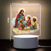 A 3D LED night light featuring a painting of Jesus with children, illuminated by a soft glow.