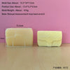 A rectangular yellow silicone mold for making candles or crafts is shown next to a measurement scale.