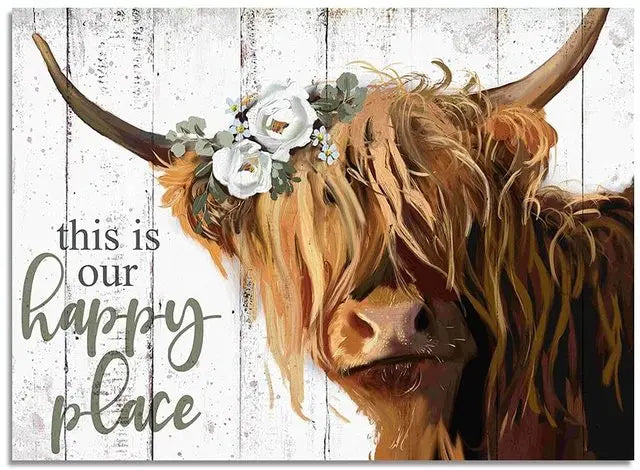 A close-up portrait of a Highland cow with horns and flowers, set against a rustic wooden background.