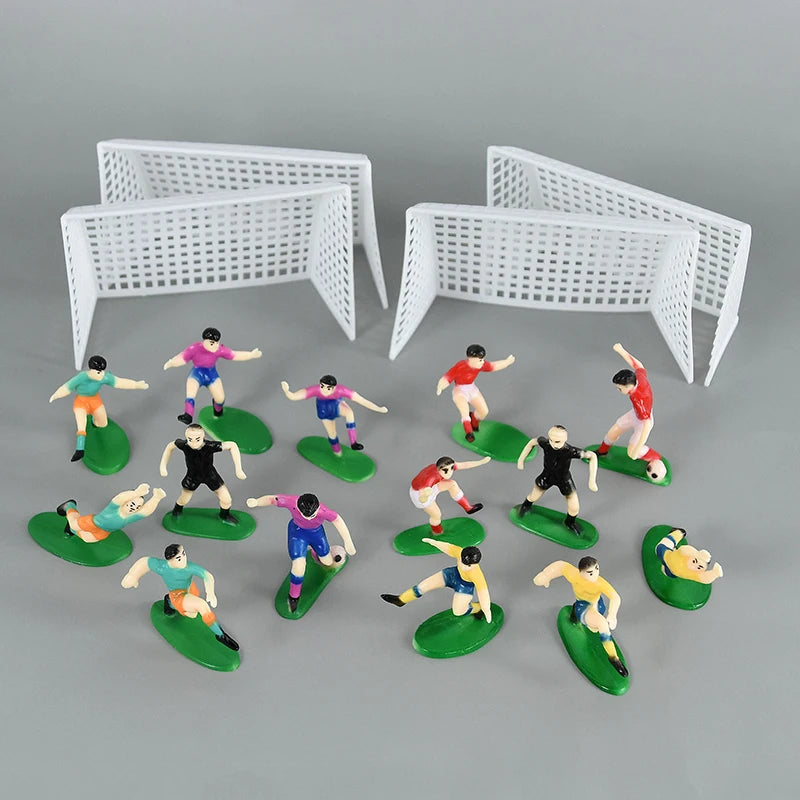 White plastic football birthday cake toppers featuring soccer players and field decor.