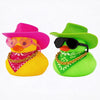 A yellow rubber duck wearing a pink cowboy hat and a red bandana, next to a green rubber duck wearing a lime green cowboy hat