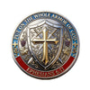 A commemorative coin design featuring a shield with a cross and text from Ephesians 6:11